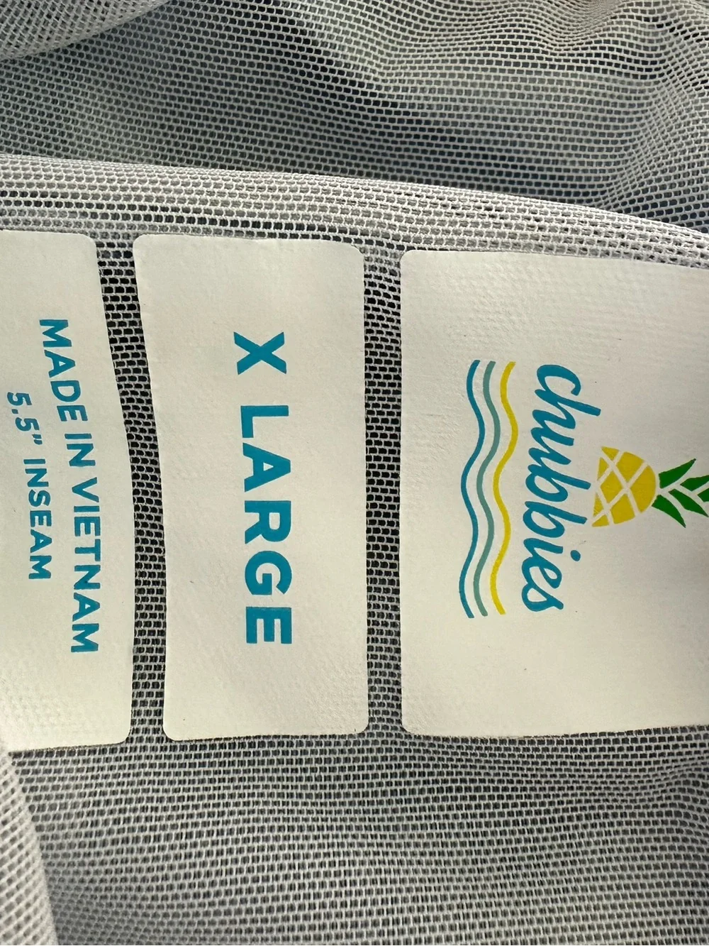 chubbies Blue Swim Trunks with Aqua Yellow and Coral Stripes 5.5”